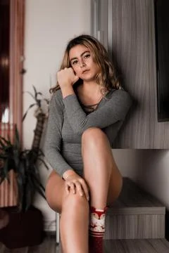 Young blonde model posing in her room Stock Photos