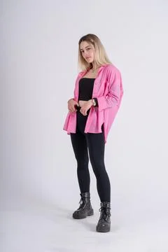 Young blonde standing posing looking at camera Foto stock
