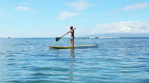 Young Blonde Surfer Boy Stand Up Paddling. Видео 54301628