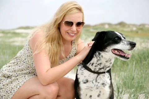 Young blonde woman with dog Stock Photos