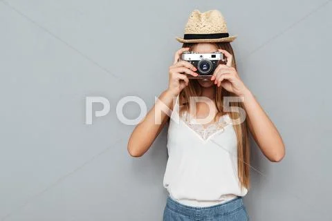 Young blonde woman making photo with camera Stock Photos