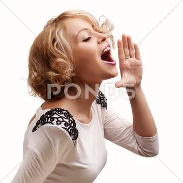 Young blonde woman shout and scream using her hands as tube, studio shoot iso Stock Photos