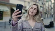 Young Blonde Woman Smiling Confident Having Video Call At Street Stock Footage