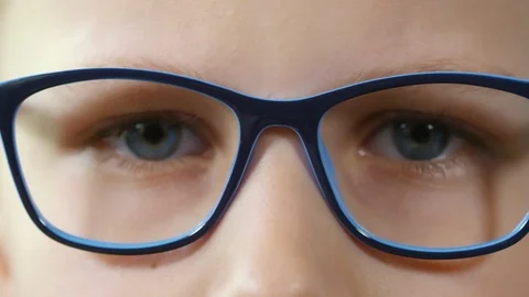 Young Blue-eyed Boy Taking off Glasses Video stock 103529189