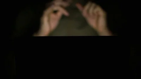 Young blurred man gets ready to work on his laptop and limbers his hands Stock Footage 74455522