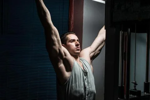 Young body builder doing heavy weight exercise for back Stock Photos