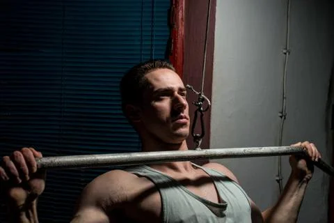 Young body builder doing heavy weight exercise for back Stock Photos