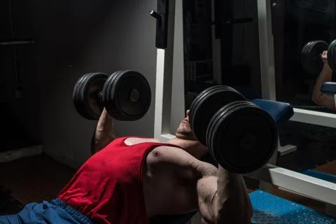 Young bodybuilder doing bench press for chest Stock Photos