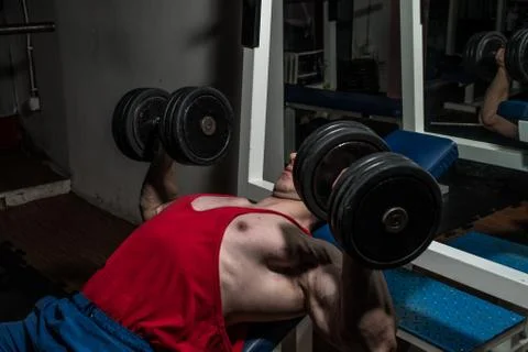 Young bodybuilder doing bench press for chest Stock Photos