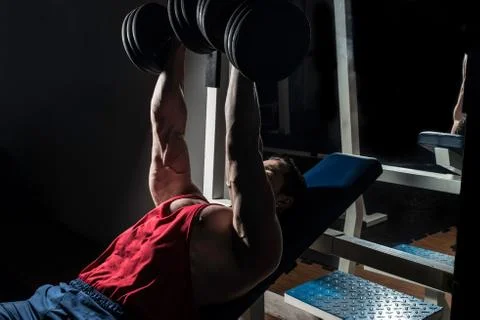 Young bodybuilder doing bench press for chest Stock Photos