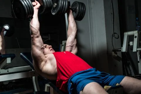 Young bodybuilder doing bench press for chest Foto stock