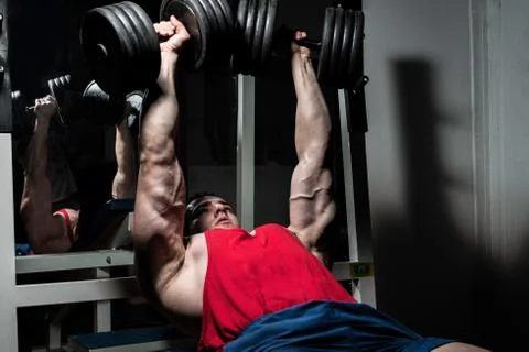 Young bodybuilder doing bench press for chest Stock Photos