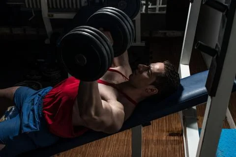 Young bodybuilder doing bench press for chest Stock Photos