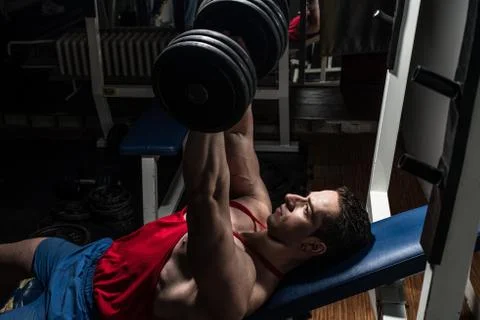 Young bodybuilder doing bench press for chest Stock Photos
