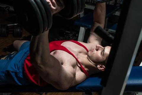 Young bodybuilder doing bench press for chest Stock Photos