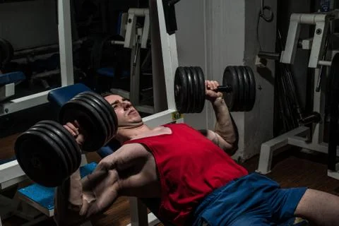 Young bodybuilder doing bench press for chest Stock Photos