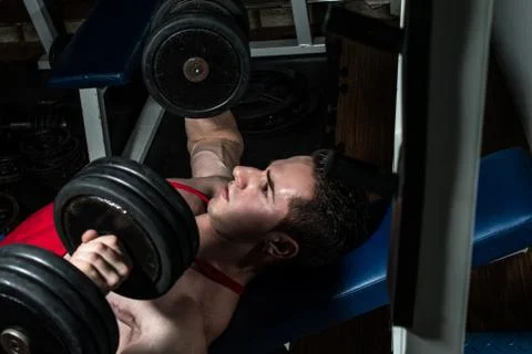 Young bodybuilder doing bench press for chest Stock Photos