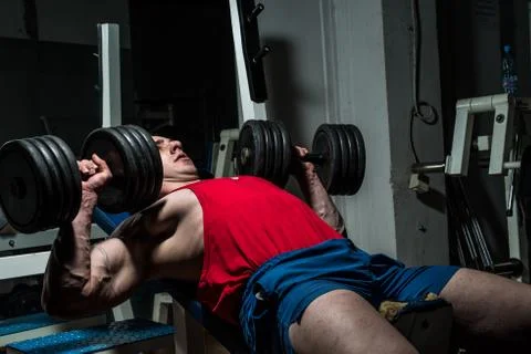 Young bodybuilder doing bench press for chest Stock Photos