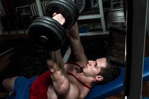 Young bodybuilder doing bench press for chest Stock Photos