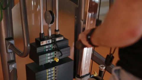 Young bodybuilder doing forearm extension in the upper crossover Stock Footage 102228118