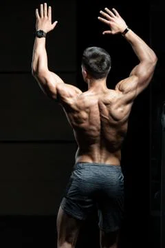 Young Bodybuilder Flexing Back Pose Stock Photos