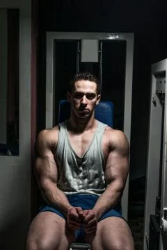 Young bodybuilder resting at the bench Stock Photos