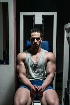 Young bodybuilder resting at the bench Stock Photos