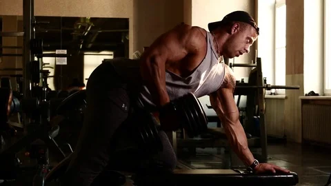Young bodybuilder training in a gym. 4K UHD Stock Footage 75834981