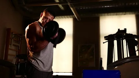 Young bodybuilder training in a gym. 4K UHD Stock Footage 75835240