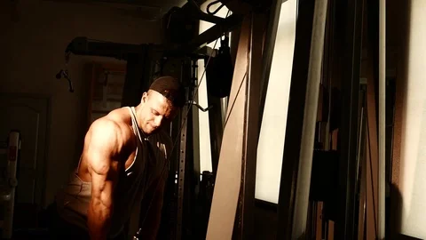 Young bodybuilder training in a gym. 4K UHD Stock Footage 75835383
