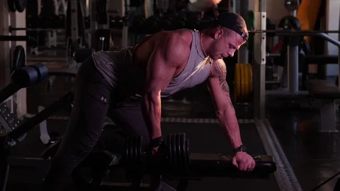 Young bodybuilder training in a gym. 4K UHD Stock Footage 75835995