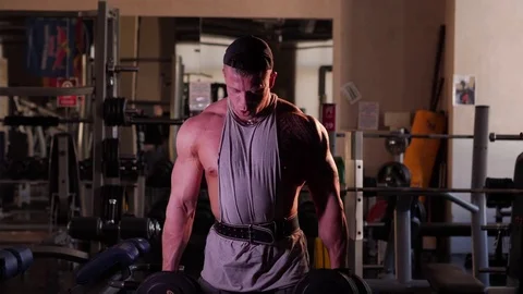 Young bodybuilder training in a gym. 4K UHD Stock Footage 75836136