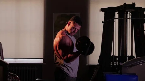 Young bodybuilder training in a gym. 4K UHD Stock Footage 75836415