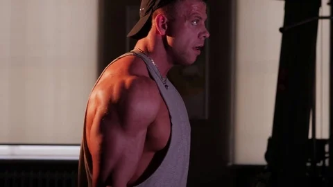 Young bodybuilder training in a gym. 4K UHD Stock Footage 75836450
