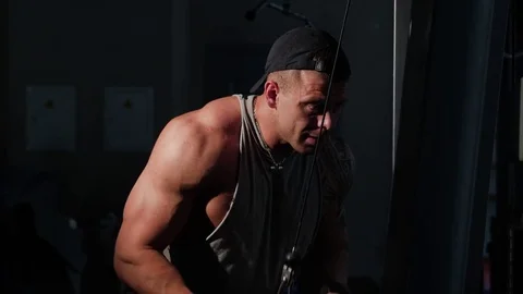 Young bodybuilder training in a gym. 4K UHD Stock Footage 75836555