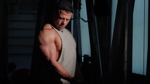 Young bodybuilder training in a gym. 4K UHD Stock Footage 75836622