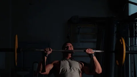 Young bodybuilder training in a gym. 4K UHD Stock Footage 75836907