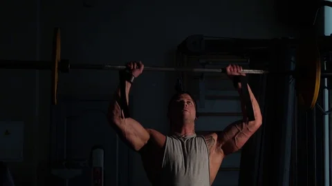 Young bodybuilder training in a gym. 4K UHD Stock Footage 75836973