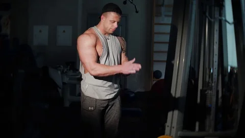 Young bodybuilder training in a gym. 4K UHD Stock Footage 75837071