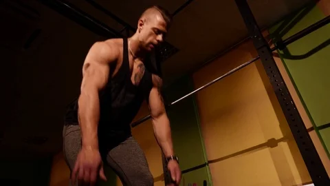 Young bodybuilder training in a gym Stock Footage 74313556