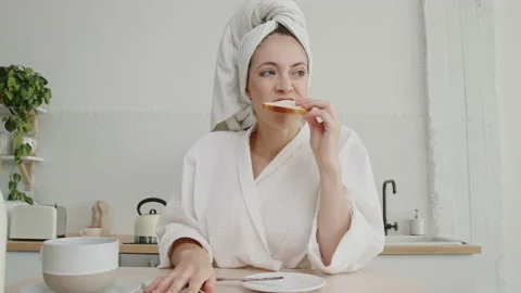 https://images.pond5.com/young-bored-woman-morning-kitchen-footage-167976407_iconl.jpeg