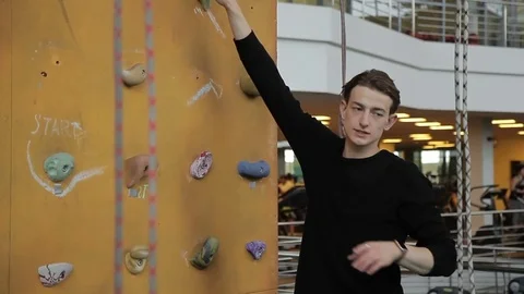 Young boulder instructor explains and shows rules for lifting. Stock Footage 83339716