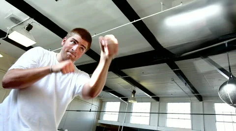 Young boxer punching bag Stock Footage 446149