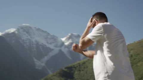 Young Boxer Training by Snowy Mountains — Athlete Fighting Nature Stock Footage 314623962