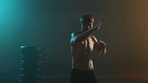 Young Boxer Trains. He Makes Hand Movements. Handsome Guy With Naked Torso. Stock Footage 160767938