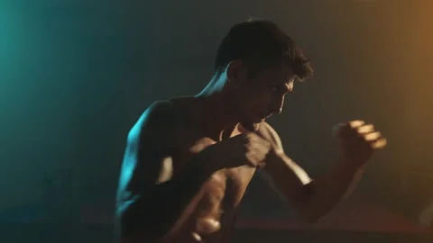 Young Boxer Trains. He Makes Hand Movements. Handsome Guy With Naked Torso. Stock Footage 160769086