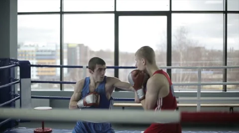 Young boxers have a fight at ring in a boxing club. Slow motion Stock Footage 57699701