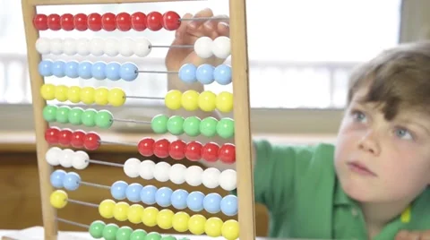 Young boy with abacus Stock Footage 43965362