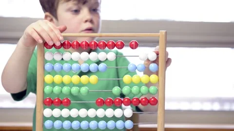 Young boy with abacus Stock Footage 43965369