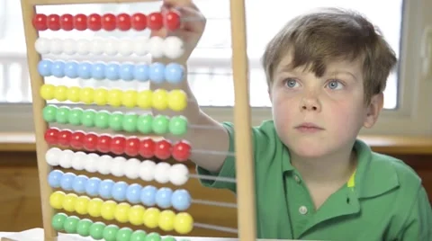 Young boy with abacus Stock Footage 43965382